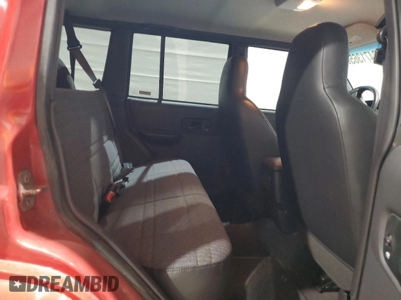 2000 Jeep Cherokee z VIN 1J4FF48S9YL260200, wystawiony jako Copart lot #52471365 z przebiegiem 89 435 mil mil oraz Szkody całkowita. Historia ofert i sprzedaży dostępna na DreamBid. Obrazek 10.