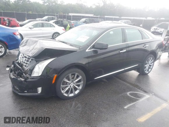 2013 Cadillac XTS Premium z VIN 2G61S5S39D9112491, wystawiony jako IAAI lot #42216373 z przebiegiem 145 338 mil mil oraz . Historia ofert i sprzedaży dostępna na DreamBid. Obrazek 2.