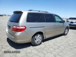 2005 Honda Odyssey EX-L with VIN 5FNRL38625B045152, listed as a Copart auction lot 57633005 with 145,776 mi miles and Salvage title. Bid and sale history available at DreamBid. Image 3.