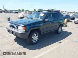 1995 Jeep Grand Cherokee Laredo with VIN 1J4GZ58Y2SC669152, listed as a IAAI auction lot 42077067 with 134,022 mi miles. Bid and sale history available at carsss.com. Image 2.