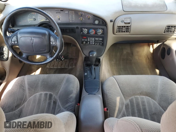 1997 Pontiac Bonneville SE z VIN 1G2HX52K7VH211607, wystawiony jako Copart lot #73705454 z przebiegiem 116 307 mil mil oraz Szkoda całkowita • Salvage title. Historia ofert i sprzedaży dostępna na DreamBid. Obrazek 8.