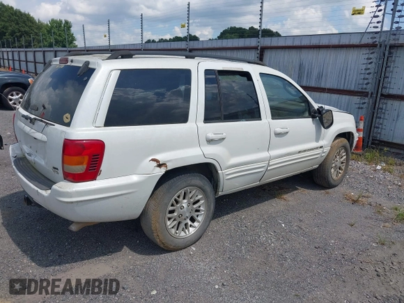 2002 Jeep Grand Cherokee Limited z VIN 1J4GX58N62C195783, wystawiony jako IAAI lot #42745397 z przebiegiem 242 502 mil mil oraz . Historia ofert i sprzedaży dostępna na DreamBid. Obrazek 4.