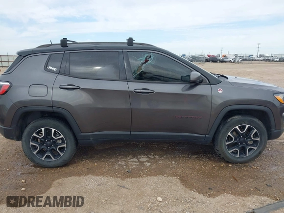 2019 Jeep Compass Trailhawk with VIN 3C4NJDDBXKT795294, listed as a IAAI auction lot 42046344 with 100,395 mi miles and . Bid and sale history available at DreamBid. Image 14.