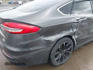 2019 Ford Fusion SEL with VIN 3FA6P0CD6KR141832, listed as a IAAI auction lot 41800102 with 142,282 mi miles and . Bid and sale history available at DreamBid. Image 21.