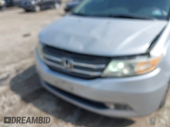 2012 Honda Odyssey EX-L with VIN 5FNRL5H61CB081634, listed as a IAAI auction lot 42760909 with 197,949 mi miles and . Bid and sale history available at DreamBid. Image 6.