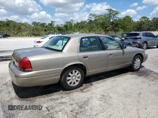 2006 Ford Crown Victoria LX z VIN 2FAFP74V56X126245, wystawiony jako Copart lot #56598055 z przebiegiem 91 400 mil mil oraz Szkody całkowita. Historia ofert i sprzedaży dostępna na DreamBid. Obrazek 3.
