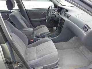 2001 Toyota Camry CE z VIN JT2BG22K410587070, wystawiony jako IAAI lot #42388043 z przebiegiem 119 183 mil mil oraz . Historia ofert i sprzedaży dostępna na DreamBid. Obrazek 5.