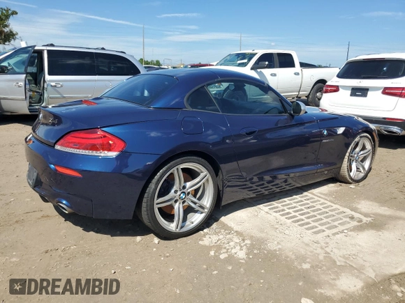 2011 BMW Z4 sDrive35is with VIN WBALM1C56BE393858, listed as a Copart auction lot 74249954 with Not provided miles and Salvage title. Bid and sale history available at DreamBid. Image 3.