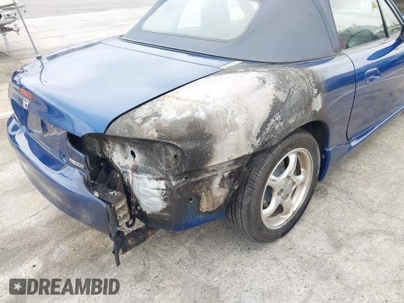 1999 Mazda MX-5 Miata with VIN JM1NB3531X0136037, listed as a IAAI auction lot 42196338 with Not provided miles and . Bid and sale history available at DreamBid. Image 6.