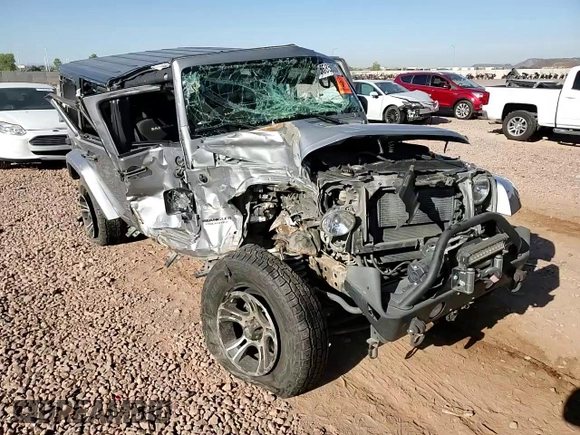 2015 Jeep Wrangler Unlimited Sahara z VIN 1C4BJWEG1FL617428, wystawiony jako Copart lot #55850005 z przebiegiem Nie podano mil oraz Szkoda całkowita • Salvage title. Historia ofert i sprzedaży dostępna na DreamBid. Obrazek 13.