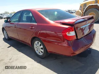 2002 Toyota Camry LE z VIN 4T1BE32K52U082454, wystawiony jako IAAI lot #42276881 z przebiegiem 225 814 mil mil oraz . Historia ofert i sprzedaży dostępna na DreamBid. Obrazek 3.