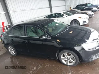 2012 Volkswagen Jetta TDI w/Premium & Nav with VIN 3VWLL7AJ8CM326549, listed as a IAAI auction lot 42748170 with 200,385 mi miles and . Bid and sale history available at DreamBid. Image 14.
