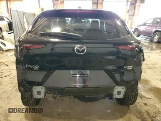 2024 Mazda CX-30 Premium z VIN 3MVDMBDY4RM689826, wystawiony jako Copart lot #43533135 z przebiegiem 10 372 mil mil oraz Szkody całkowita. Historia ofert i sprzedaży dostępna na DreamBid. Obrazek 6.