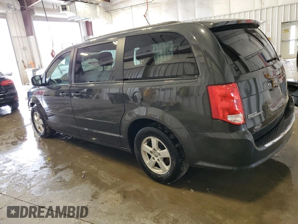 2012 Dodge Grand Caravan SXT with VIN 2C4RDGCG0CR191037, listed as a Copart auction lot 50930675 with 142,093 mi miles and Salvage Title. Bid and sale history available at DreamBid. Image 2.