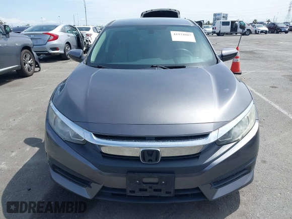 2017 Honda Civic LX with VIN 2HGFC2F52HH566363, listed as a IAAI auction lot 41934807 with 94,063 mi miles and . Bid and sale history available at DreamBid. Image 12.
