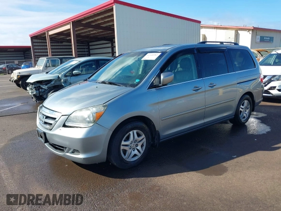 2007 Honda Odyssey EX-L with VIN 5FNRL38677B021464, listed as a IAAI auction lot 41568582 with 131,359 mi miles and . Bid and sale history available at DreamBid. Image 2.