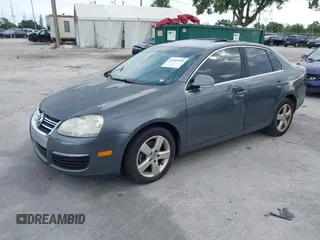 2009 Volkswagen Jetta SE z VIN 3VWRM71K99M167159, wystawiony jako IAAI lot #42409998 z przebiegiem 78 459 mil mil oraz . Historia ofert i sprzedaży dostępna na DreamBid. Obrazek 2.