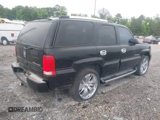 2003 Cadillac Escalade z VIN 1GYEK63N13R140496, wystawiony jako IAAI lot #42366303 z przebiegiem 90 940 mil mil oraz . Historia ofert i sprzedaży dostępna na DreamBid. Obrazek 4.