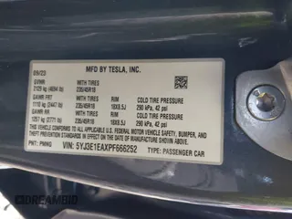 2023 Tesla Model 3 with VIN 5YJ3E1EAXPF666252, listed as a IAAI auction lot 42009929 with 27,328 mi miles and . Bid and sale history available at DreamBid. Image 9.