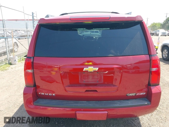 2015 Chevrolet Tahoe LT with VIN 1GNSKBKC6FR628355, listed as a IAAI auction lot 42159743 with 95,730 mi miles and . Bid and sale history available at DreamBid. Image 16.