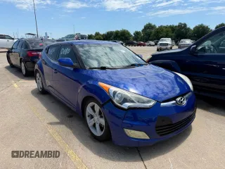2013 Hyundai Veloster w/Black Int z VIN KMHTC6AD1DU094781, wystawiony jako Copart lot #60271115 z przebiegiem 122 541 mil mil oraz Szkoda całkowita • Salvage title. Historia ofert i sprzedaży dostępna na DreamBid. Obrazek 1.