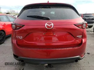 2021 Mazda CX-5 Grand Touring Reserve with VIN JM3KFBAY4M0358478, listed as a Copart auction lot 50839815 with 84,932 mi miles and Salvage Title. Bid and sale history available at DreamBid. Image 6.