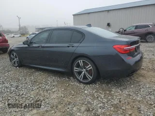 2019 BMW 7 Series 750i with VIN WBA7F0C54KGM25281, listed as a Copart auction lot 84741334 with 76,472 mi miles and Salvage Title. Bid and sale history available at carsss.com. Image 2.