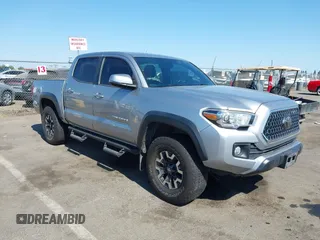 2018 Toyota Tacoma SR with VIN 5TFCZ5AN5JX162631, listed as a IAAI auction lot 42616898 with 117,134 mi miles and . Bid and sale history available at DreamBid. Image 1.