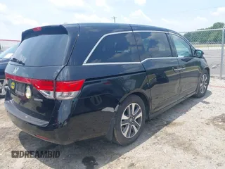 2015 Honda Odyssey Touring Elite with VIN 5FNRL5H90FB003506, listed as a IAAI auction lot 42585049 with 120,543 mi miles and . Bid and sale history available at DreamBid. Image 4.