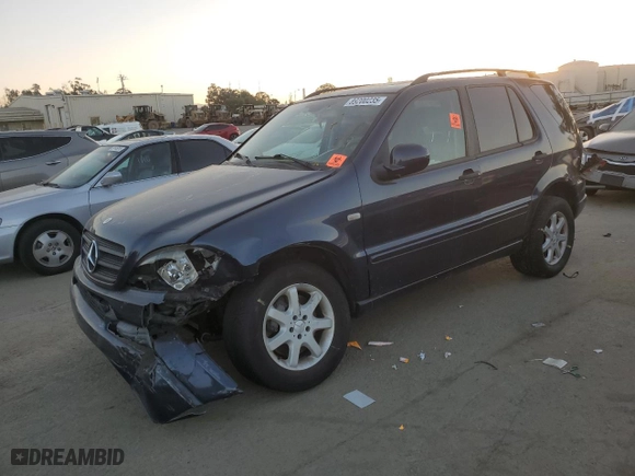 2001 Mercedes-Benz M-Class with VIN 4JGAB72E91A260677, listed as a Copart auction lot 89200235 with 180,414 mi miles and Salvage Title. Bid and sale history available at carsss.com. Image 1.