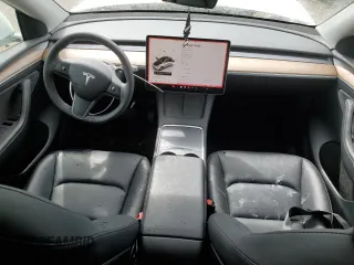 2023 Tesla Model Y Long Range z VIN 7SAYGAEE0PF693613, wystawiony jako Copart lot #54452895 z przebiegiem 19 574 mil mil oraz Szkoda całkowita • Salvage title. Historia ofert i sprzedaży dostępna na DreamBid. Obrazek 8.