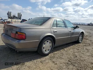 1998 Cadillac Seville SLS z VIN 1G6KS54YXWU931108, wystawiony jako Copart lot #72369984 z przebiegiem 103 267 mil mil oraz Szkoda całkowita • Salvage title. Historia ofert i sprzedaży dostępna na DreamBid. Obrazek 3.