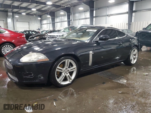 2007 Jaguar XK with VIN SAJWA43C479B18700, listed as a Copart auction lot 83377684 with 143,746 mi miles and Salvage Title. Bid and sale history available at carsss.com. Image 1.