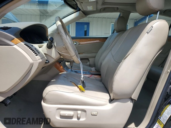 2005 Toyota Avalon XL z VIN 4T1BK36B05U022928, wystawiony jako Copart lot #59137785 z przebiegiem 146 854 mil mil oraz Szkoda całkowita • Salvage title. Historia ofert i sprzedaży dostępna na DreamBid. Obrazek 7.
