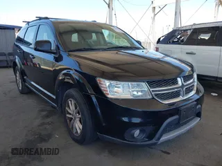 2015 Dodge Journey SXT z VIN 3C4PDCBG0FT697454, wystawiony jako IAAI lot #42642643 z przebiegiem 148 113 mil mil oraz . Historia ofert i sprzedaży dostępna na DreamBid. Obrazek 1.