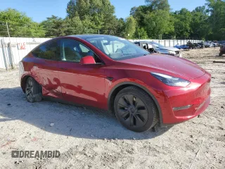 2024 Tesla Model Y Long Range with VIN 7SAYGDEE6RA318973, listed as a Copart auction lot 55586435 with 8,700 mi miles and Salvage title. Bid and sale history available at DreamBid. Image 4.