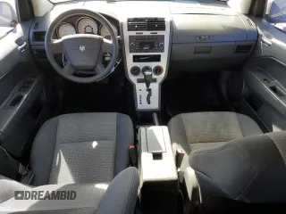 2009 Dodge Caliber SXT with VIN 1B3HB48A09D116274, listed as a Copart auction lot 49222585 with 144,852 mi miles and Salvage Title. Bid and sale history available at DreamBid. Image 8.