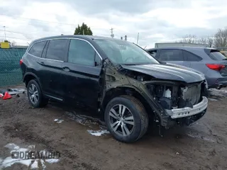 2016 Honda Pilot EX-L with VIN 5FNYF6H5XGB010700, listed as a IAAI auction lot 41895396 with 137,153 mi miles. Bid and sale history available at carsss.com. Image 1.