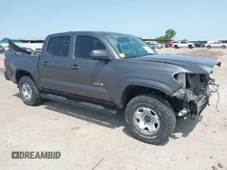 2021 Toyota Tacoma SR with VIN 5TFCZ5AN5MX258408, listed as a IAAI auction lot 42388670 with 73,611 mi miles and . Bid and sale history available at DreamBid. Image 1.