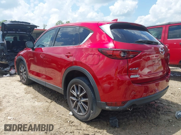 2018 Mazda CX-5 Grand Touring with VIN JM3KFADM4J0335913, listed as a IAAI auction lot 42326044 with 104,583 mi miles and . Bid and sale history available at DreamBid. Image 3.