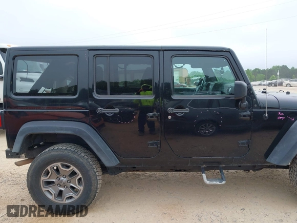 2015 Jeep Wrangler Unlimited Rubicon with VIN 1C4BJWFG7FL688728, listed as a IAAI auction lot 42054304 with 100,152 mi miles and . Bid and sale history available at DreamBid. Image 13.