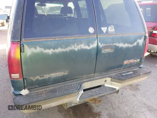 1997 GMC Yukon with VIN 1GKEK13R1VJ723409, listed as a IAAI auction lot 41512184 with 235,988 mi miles. Bid and sale history available at carsss.com. Image 6.