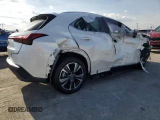 2025 Lexus UX with VIN JTHYBJAHXS2013108, listed as a Copart auction lot 45136895 with 1,350 mi miles and Salvage title. Bid and sale history available at DreamBid. Image 3.