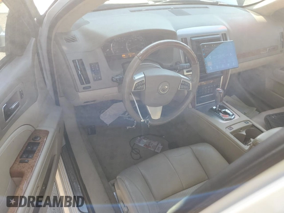 2010 Cadillac STS AWD z VIN 1G6DU6EV0A0101850, wystawiony jako Copart lot #83113264 z przebiegiem 103 491 mil mil oraz Szkoda całkowita • Salvage title. Historia ofert i sprzedaży dostępna na DreamBid. Obrazek 8.