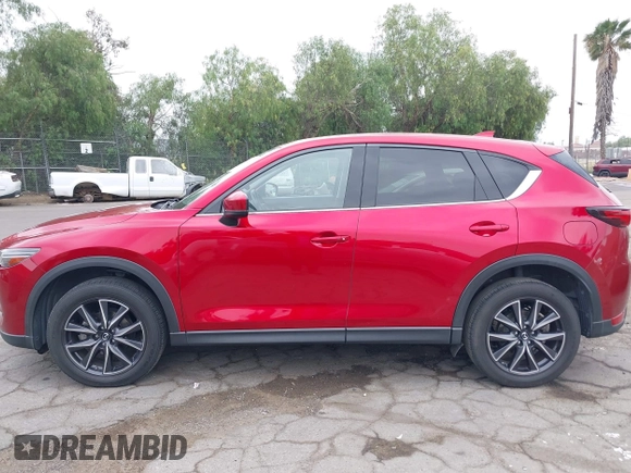 2018 Mazda CX-5 Grand Touring with VIN JM3KFADMXJ0302656, listed as a IAAI auction lot 42099173 with 125,378 mi miles and . Bid and sale history available at DreamBid. Image 14.