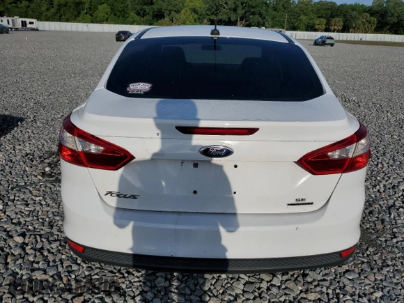 2014 Ford Focus SE with VIN 1FADP3F27EL412368, listed as a Copart auction lot 51463155 with 143,484 mi miles and Salvage Title. Bid and sale history available at DreamBid. Image 6.
