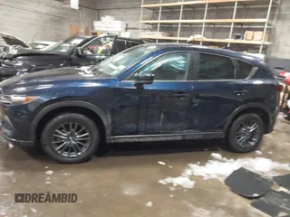 2020 Mazda CX-5 Touring z VIN JM3KFBCM9L0843045, wystawiony jako IAAI lot #41361008 z przebiegiem 76 107 mil mil oraz . Historia ofert i sprzedaży dostępna na DreamBid. Obrazek 14.