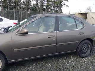 1999 Nissan Altima XE with VIN 1N4DL01D1XC210017, listed as a IAAI auction lot 41199544 with 297,917 mi miles. Bid and sale history available at carsss.com. Image 14.
