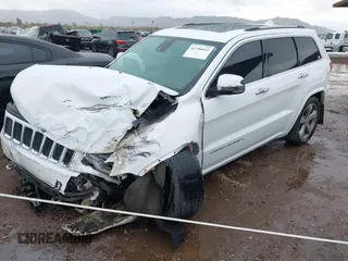 2014 Jeep Grand Cherokee Overland with VIN 1C4RJFCG9EC162098, listed as a IAAI auction lot 41746022 with 120,588 mi miles and . Bid and sale history available at DreamBid. Image 2.