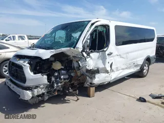 2018 Ford Transit Passenger Wagon XL with VIN 1FBZX2YM0JKA87639, listed as a IAAI auction lot 38957868 with 1 mi miles. Bid and sale history available at carsss.com. Image 2.